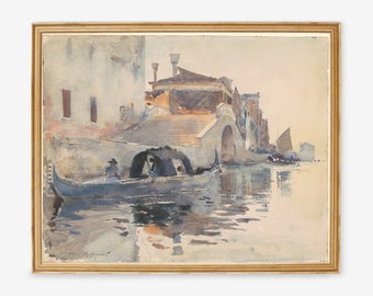 May include: Watercolor painting of a Venetian canal scene. A gondola with passengers floats on the water, passing under a stone bridge. Buildings line the canal, and the artwork is framed in a gold-colored frame.
