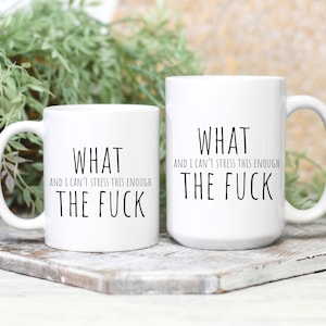 May include: Two white ceramic mugs with black text. The text on both mugs reads "What and I can't stress this enough the fuck".