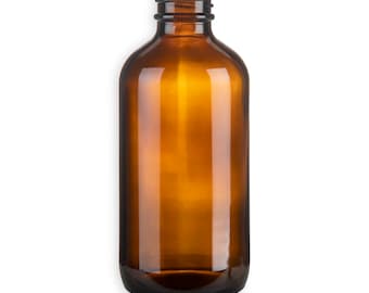 May include: A clear amber glass bottle with a wide mouth and a rounded bottom. The bottle is empty and has a smooth surface.