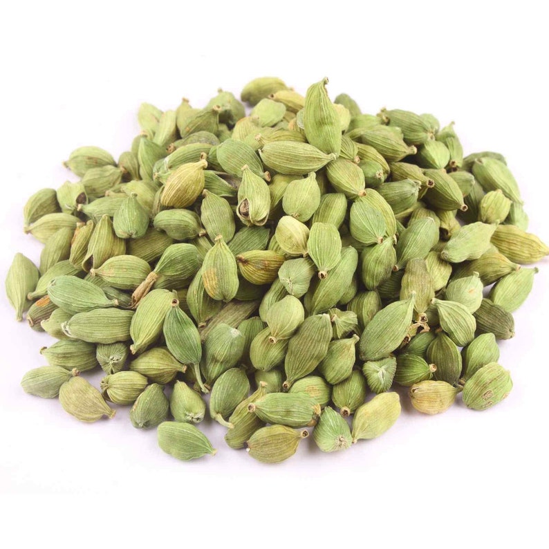 May include: A pile of green cardamom pods, a popular spice used in cooking and baking.
