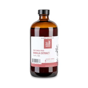 May include: A brown glass bottle of pure single fold vanilla extract, labeled "SLO FOOD GROUP" and "16 FL. OZ.". The bottle is on a white background.