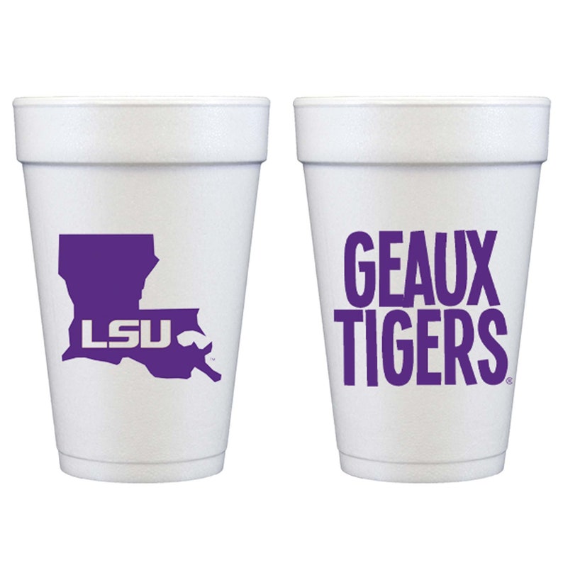 May include: Two white foam cups with purple graphics. One cup features the Louisiana state outline with "LSU" inside. The other cup displays "GEAUX TIGERS" in bold letters. These cups are perfect for game day or any LSU event.