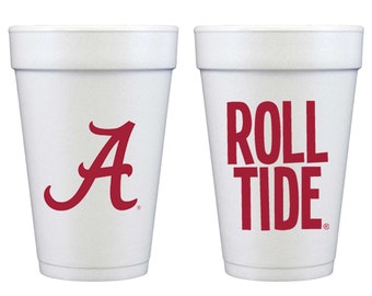 May include: Two white foam cups featuring red printed graphics. The first cup displays a large red letter A logo. The second cup features the red text ROLL TIDE stacked in two lines. Both cups have a textured surface and a tapered cylindrical shape.
