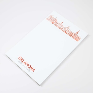 May include: White notepad with a red outline of the Oklahoma State University campus and the text "OKLAHOMA State University" in red.