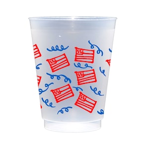 May include: A clear plastic cup with a red, white, and blue American flag pattern. The flags are scattered randomly on the cup, and there are blue squiggly lines that look like confetti.