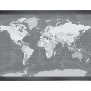 May include: A black and white world map with country borders and names printed on a grey background. The map is framed in a black frame.