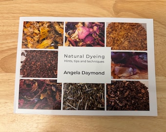 May include: A softcover book titled Natural Dyeing: Hints, tips and techniques by Angela Daymond. The white cover features a collage of seven rectangular photographs showing various dried plant materials used for natural fabric dyeing.