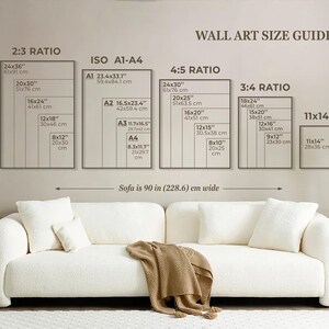 May include: A wall art size guide with different ratios and measurements in inches and centimeters. The guide shows the dimensions of various sizes of wall art, including 2:3, 4:5, 3:4, and 11x14 ratios. The guide also includes the standard ISO paper sizes A1, A2, A3, and A4. The text "Sofa is 90 in (228.6) cm wide" is displayed below the guide.