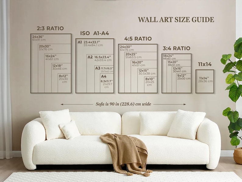 May include: A wall art size guide with different ratios and measurements in inches and centimeters. The guide shows the dimensions of various sizes of wall art, including 2:3, 4:5, 3:4, and 11x14 ratios. The guide also includes the standard ISO paper sizes A1, A2, A3, and A4. The text "Sofa is 90 in (228.6) cm wide" is displayed below the guide.