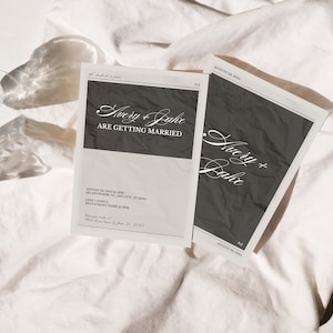 May include: Two wedding invitations with a black and white design. The top invitation reads "Avery & Jake are getting married". The bottom invitation reads "Avery & Jake".