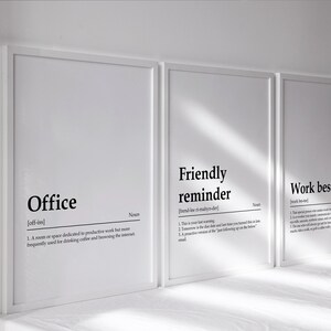 May include: Three white framed prints with black text defining the words "Office", "Friendly reminder", and "Work bestie".