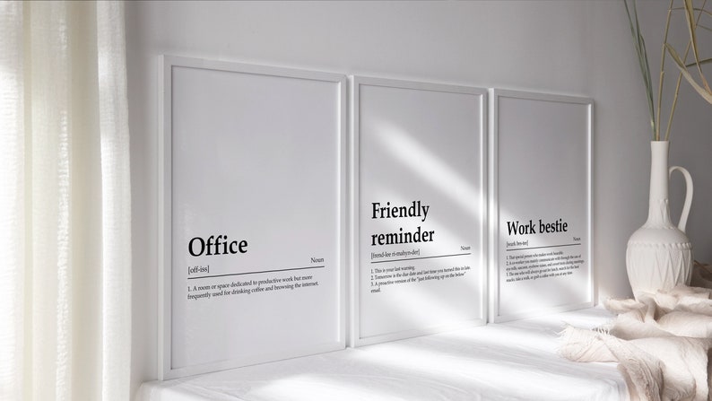 May include: Three white framed prints with black text defining the words "Office", "Friendly reminder", and "Work bestie".