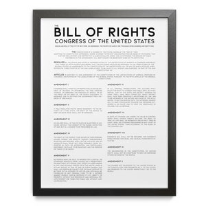 May include: A framed print of the Bill of Rights, with black frame and white background. The text includes the title, "The Bill of Rights," and the text of the amendments. The print is a historical document.