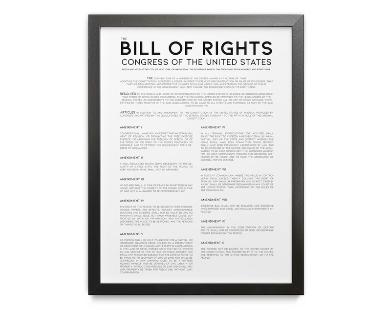 May include: A framed print of the Bill of Rights, with black frame and white background. The text includes the title, "The Bill of Rights," and the text of the amendments. The print is a historical document.