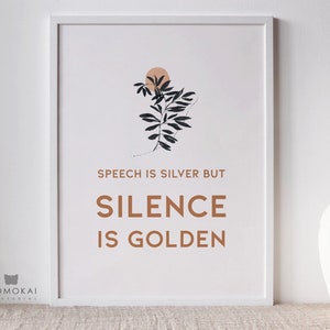 May include: A white framed print with a minimalist design featuring a black silhouette of a branch with leaves and a peach colored circle. The text "Speech is silver but silence is golden" is printed in brown below the image.