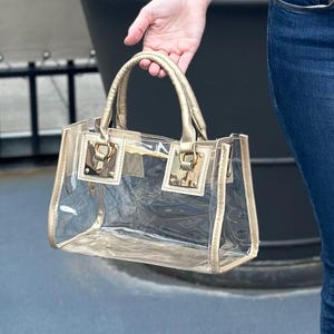Paquete de bolsos transparentes Monedero transparente Bolso de estadio transparente con detalles dorados Bolso de mano transparente
