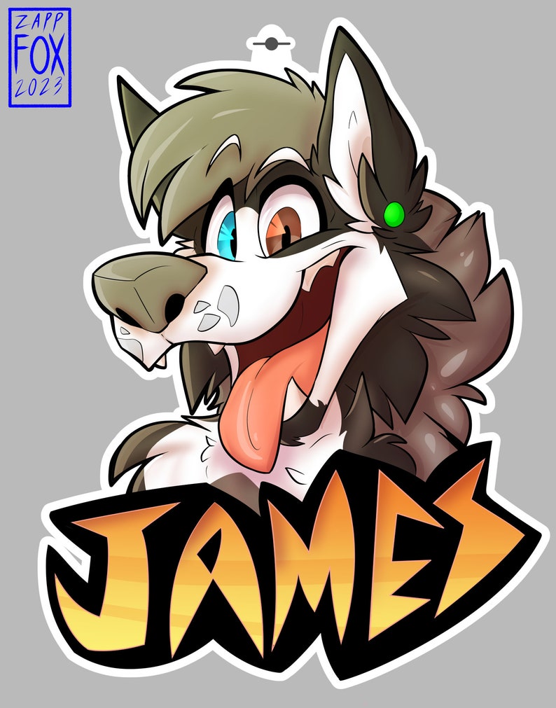May include: A cartoon wolf with brown, white and grey fur, blue and brown eyes, and a green earring. The wolf is sticking its tongue out and has a big smile. The wolf's name, "JAMES", is written in large, yellow letters below the wolf's head.