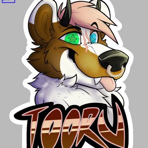 May include: A cartoon illustration of a furry animal with brown fur, white fur, pink hair, and green and blue eyes. The animal has a nose ring and is sticking its tongue out. The animal's name, "TOORU", is written in large, stylized letters below the animal.