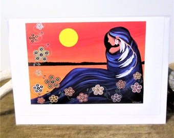 May include: A greeting card featuring a painting of a woman in a blue shawl sitting in a field of flowers against a sunset background.