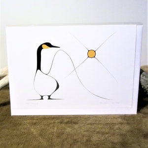 May include: A black and white stylized illustration of a goose with a yellow beak and a yellow circle with a black outline in the background. The goose is facing the right side of the image and has a curved neck. The goose is standing on a white surface. The background is white.
