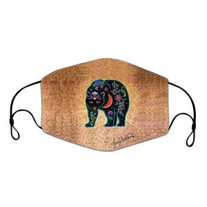 May include: A black bear with floral details on a gold background. The bear is walking to the right and has a crescent moon on its back. The mask is made of fabric and has black elastic straps.