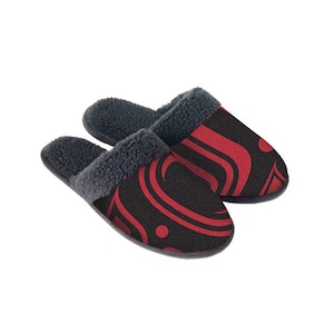 May include: A pair of black and red patterned slippers with a fuzzy lining. The slippers have a geometric design with red swirls on a black background.