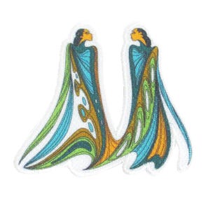 May include: A decorative patch showing two stylized figures with flowing robes. The figures have yellow skin and black hair. The robes are in shades of blue, green, and gold, with white details. The patch has a white border.