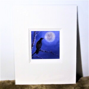 May include: A black crow perched on a branch against a backdrop of a blue night sky with a full moon.