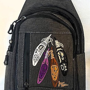 May include: A grey crossbody bag with a zipped pocket and a front pocket featuring an embroidered design of four colourful feathers with the artist's signature "Jason Peters".