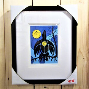 May include: Framed print of a black raven with a yellow moon in the background. The raven is perched on a branch with a blue and white background.