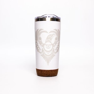 May include: White stainless steel travel mug with a cork bottom. The mug features a gray and white design of an eagle with outstretched wings in the shape of a heart.