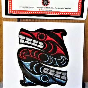 May include: An embroidered patch featuring a stylised black, red and blue wolf design. The patch is on a white background and has the text "EMBROIDERY PATCH" at the top and "Copyright © 2005-Golden Top All rights reserved" at the bottom.