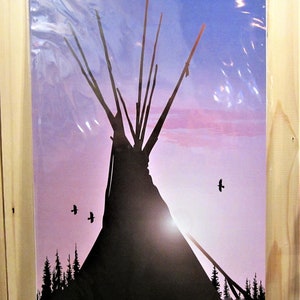 May include: A framed print featuring a silhouette of a Native American teepee against a sunset sky. The artwork includes silhouetted trees and birds in flight, with a color palette of purple, blue, and black.