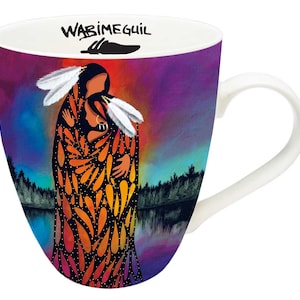 May include: A white ceramic mug with a colorful image of two figures embracing. The background is a purple and blue gradient with a reflection of the figures in a lake. The text "WABIMEGUIIL" is printed on the mug.
