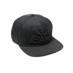 May include: A black baseball cap with a black embroidered design of a bird on the front.