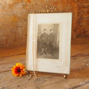 Large antique French photo or picture frame with thick beveled glass and brass bow ribbon