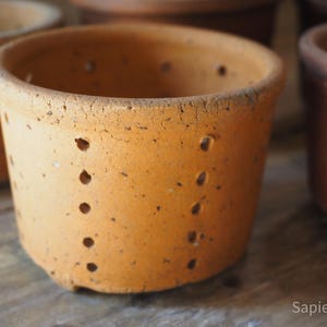 Large handmade antique French terracotta cheese mould on 3 little feet, orange sandstone, cheese strainer, faisselle mal