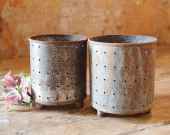 Pair of handmade antique French metal cheese moulds, on 3 little feet, candle holders