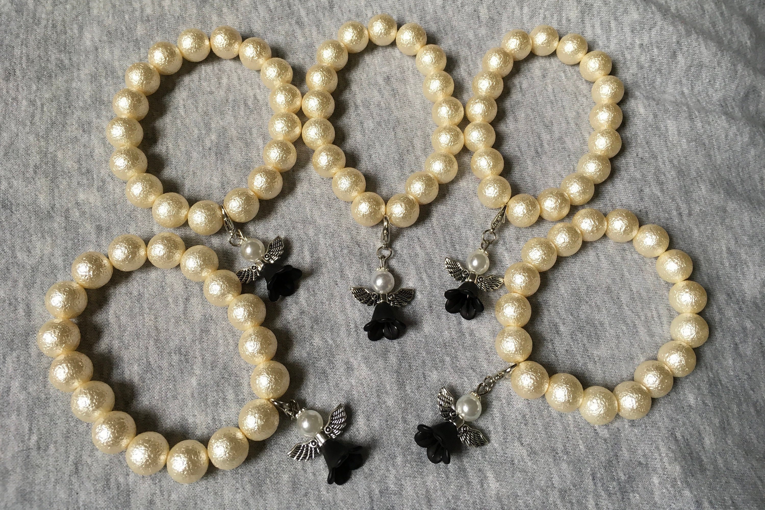 5 bracelets with angels