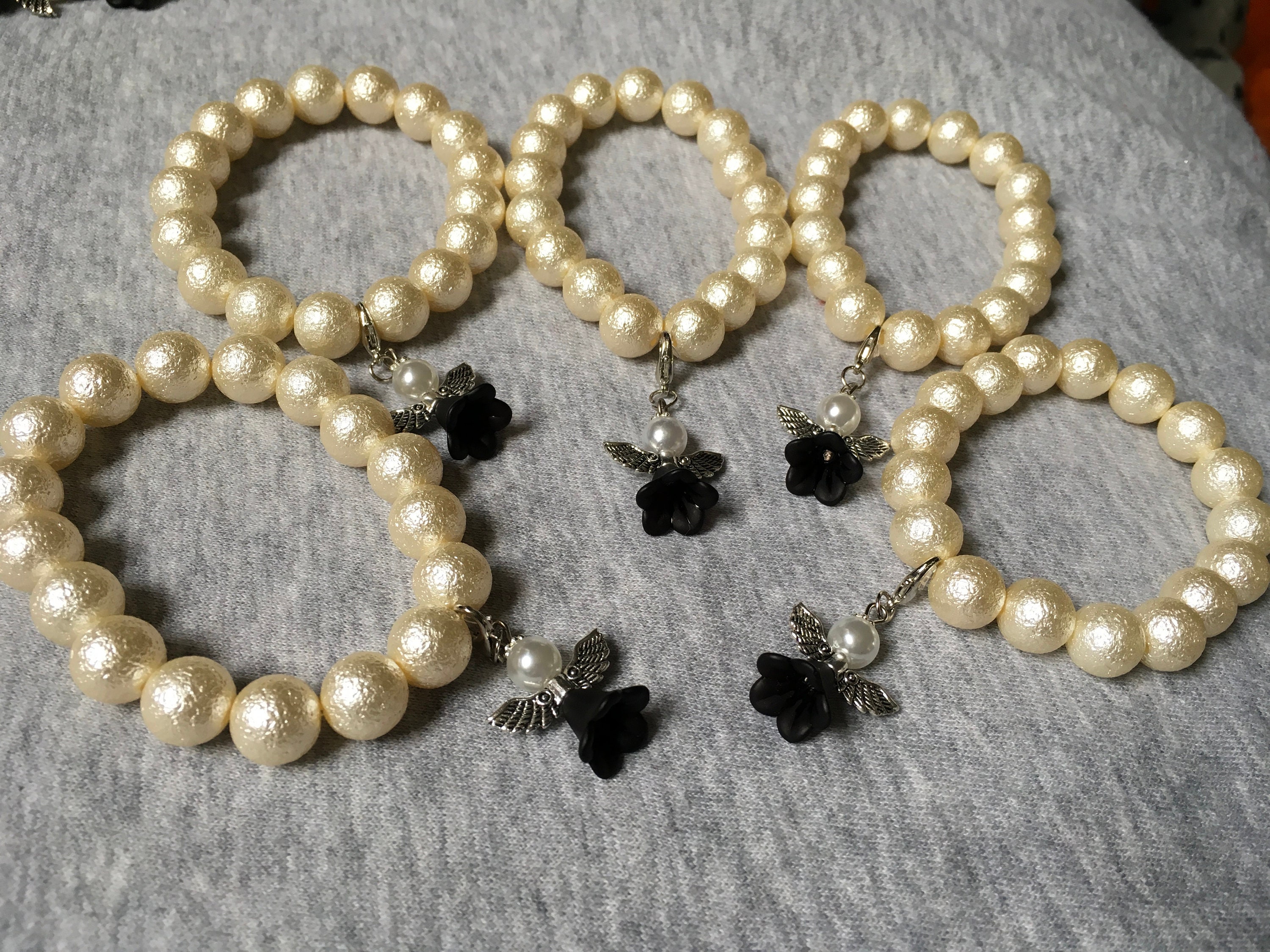 5 bracelets with angels