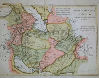 May include: An antique map of Persia and Georgia, depicting the various provinces and regions of the area. The map is coloured in shades of green, pink, and yellow, with a French title at the top.