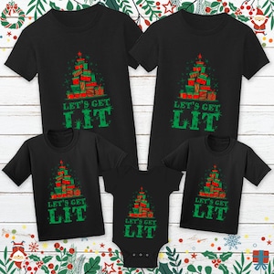 May include: A set of four black t-shirts with a Christmas tree design and the text "Let's Get Lit". The shirts are in different sizes for adults and children.