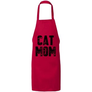 May include: Red kitchen apron with black text that reads "CAT MOM".