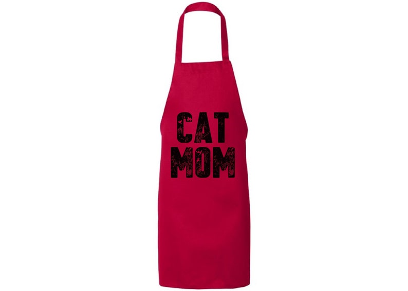 May include: Red kitchen apron with black text that reads "CAT MOM".
