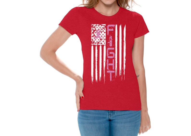 May include: Red t-shirt with a white and pink American flag design. The flag has the word "FIGHT" written vertically down the right side.