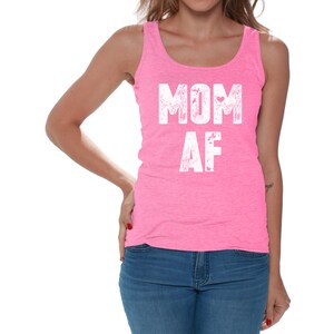 May include: Pink tank top with the text "MOM AF" in white lettering.
