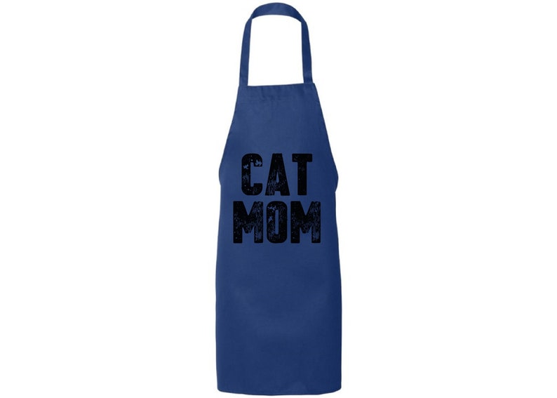 May include: A navy blue apron with the text "CAT MOM" in black, distressed lettering.