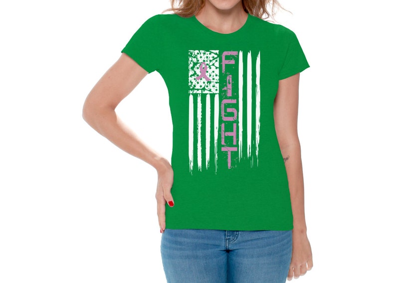 May include: A green t-shirt with a white and pink American flag design. The flag has the word "FIGHT" written vertically in pink on the right side.