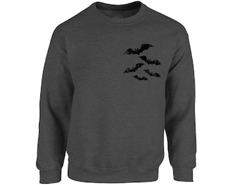 May include: A dark heather grey sweatshirt with a graphic of a group of bats in flight.