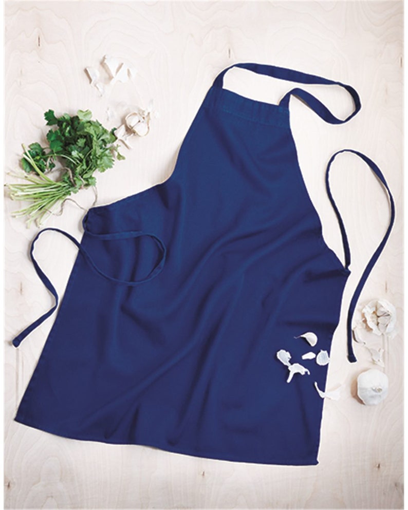 May include: A dark blue apron with adjustable neck and waist ties. The apron is made of a durable, easy-to-clean fabric.